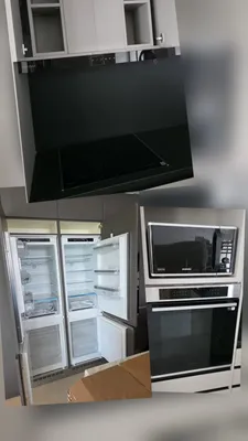 Campana, Heladera y la columna de Horno y Microondas de una misma cocina.